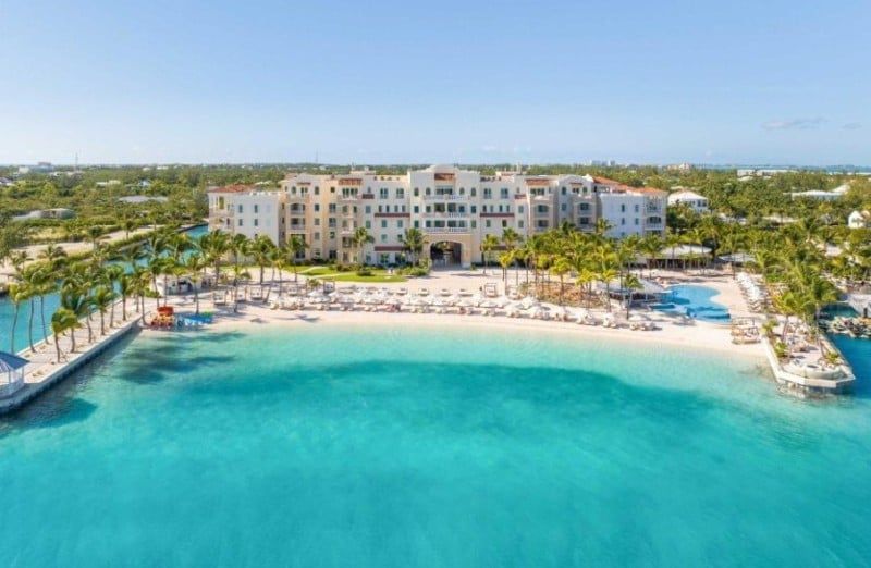 Exterior of Blue Haven Resort showcasing its private beach, marina, and tropical landscaping in Providenciales, Turks & Caicos